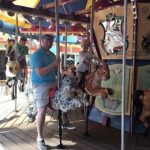 A group of people riding on a carousel aboard the Royal Caribbean Allure of the Seas.