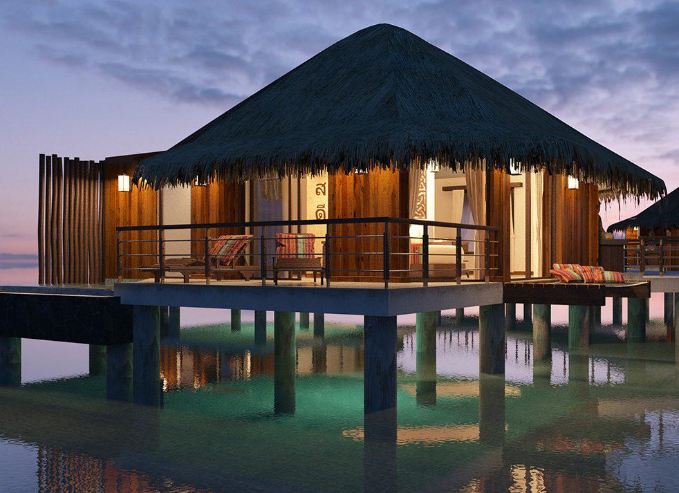 Two huts on stilts in the water at Secrets Maroma Beach.
