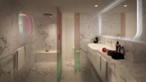 A Virgin Voyages bathroom with marble floors and a colorful mirror.