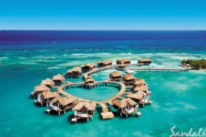 An aerial view of a Sandals resort in the middle of the ocean.